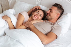 Happy couple at bed